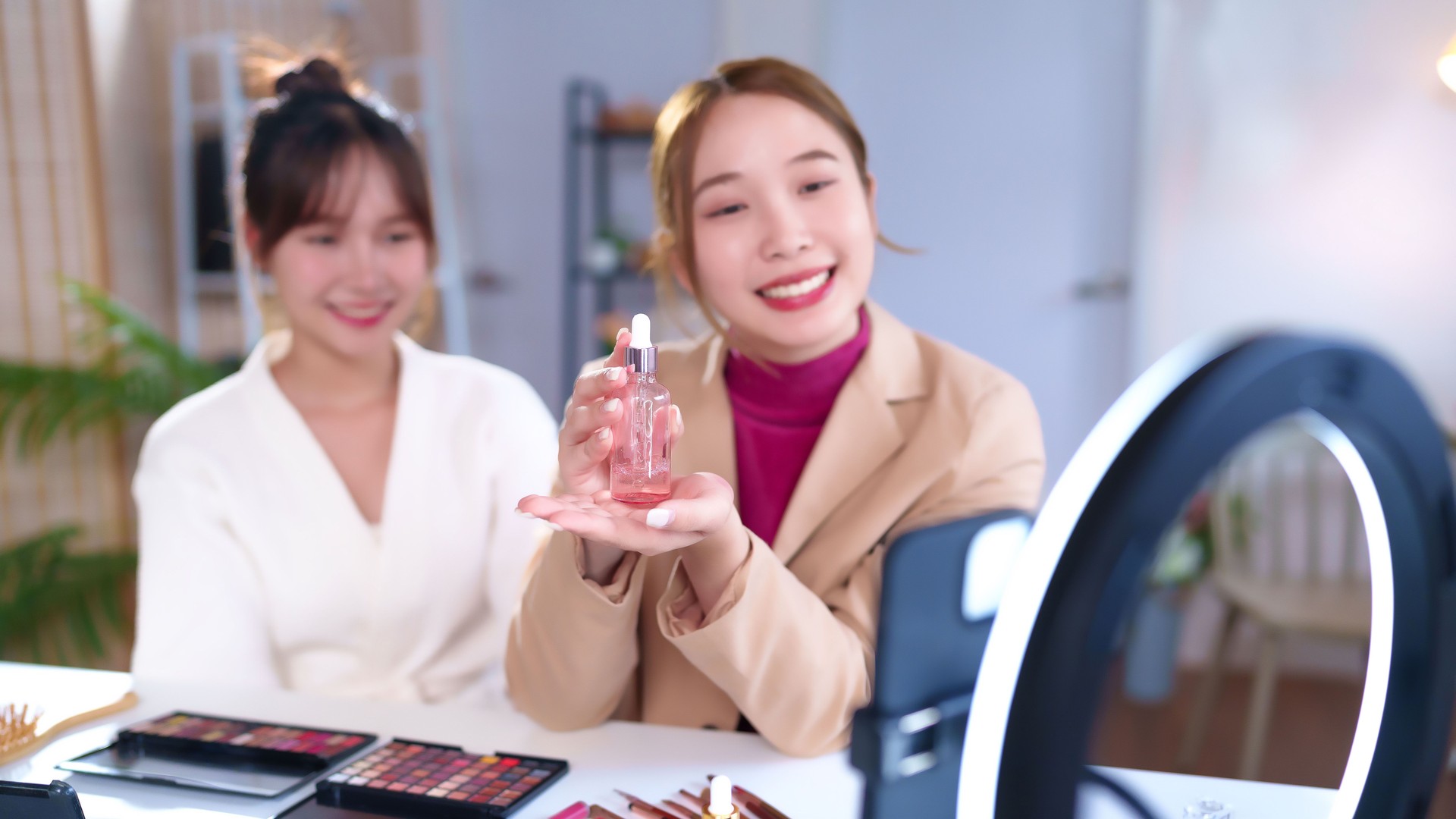 Asian Women Promote Skincare Serum Product for Beauty Routine and Healthy Skin, Influencer Live Streaming Cosmetic Review with Friend