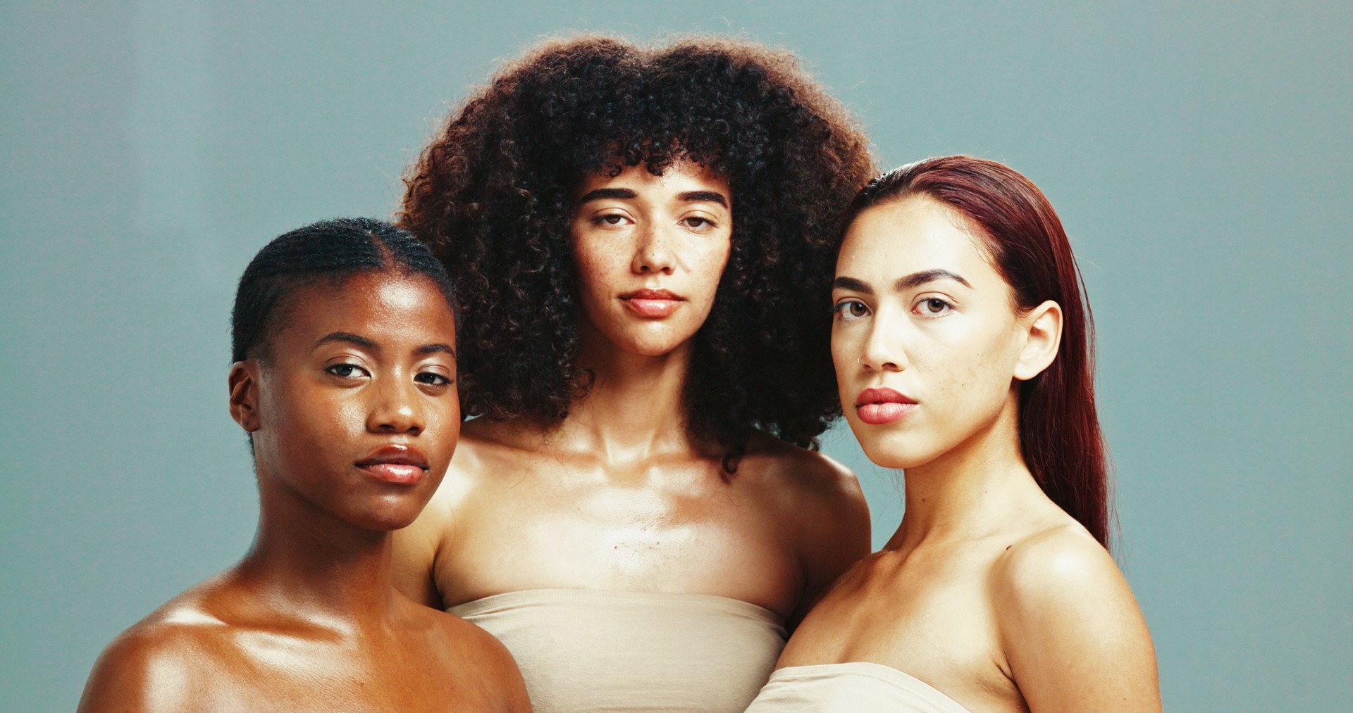 Women, diversity and portrait for skincare in studio background for inclusive beauty. Natural, people and eyes closed with glow in confidence with empowerment, body care and skin treatment or support